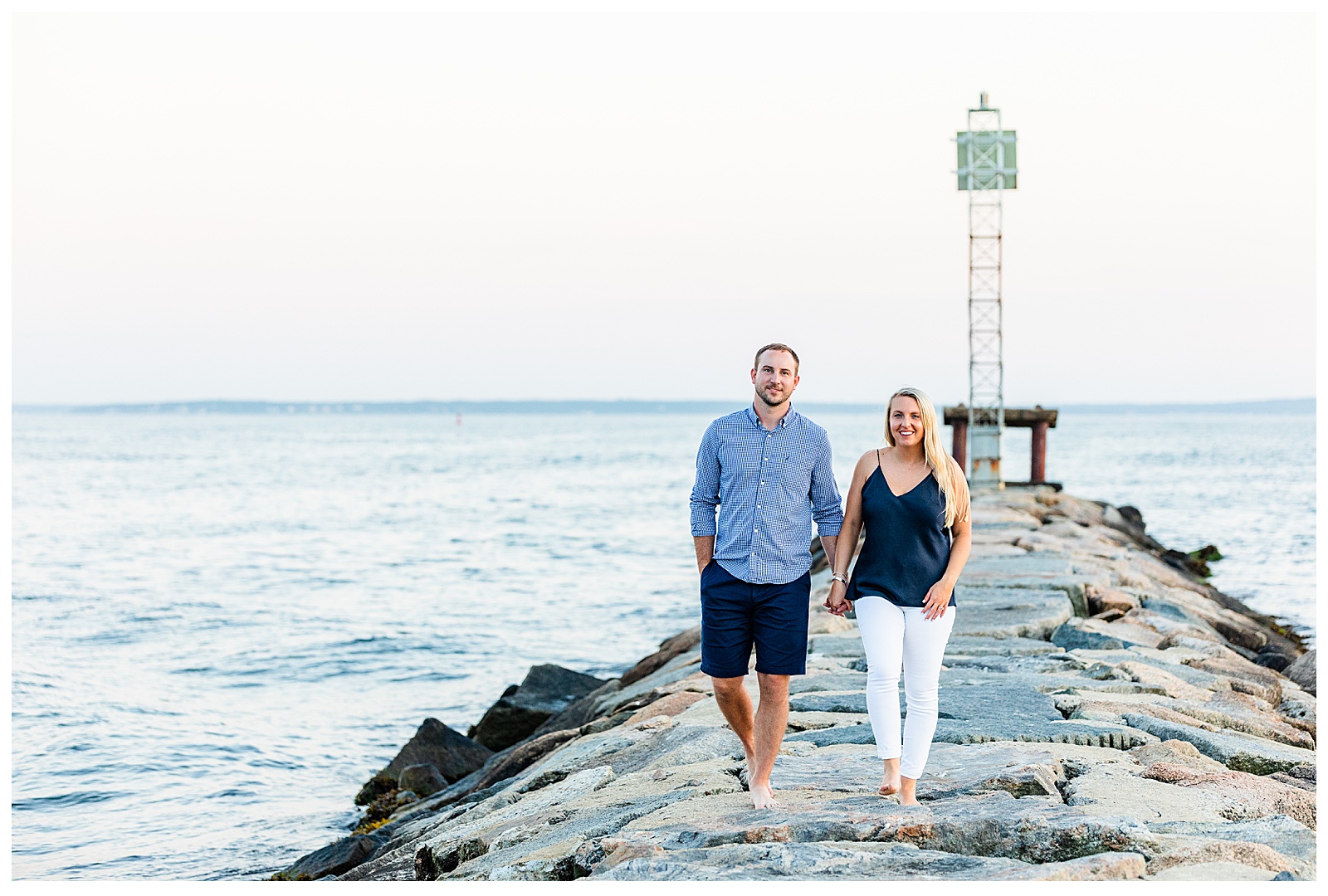 devinn & tyler walking towards camera on jetty