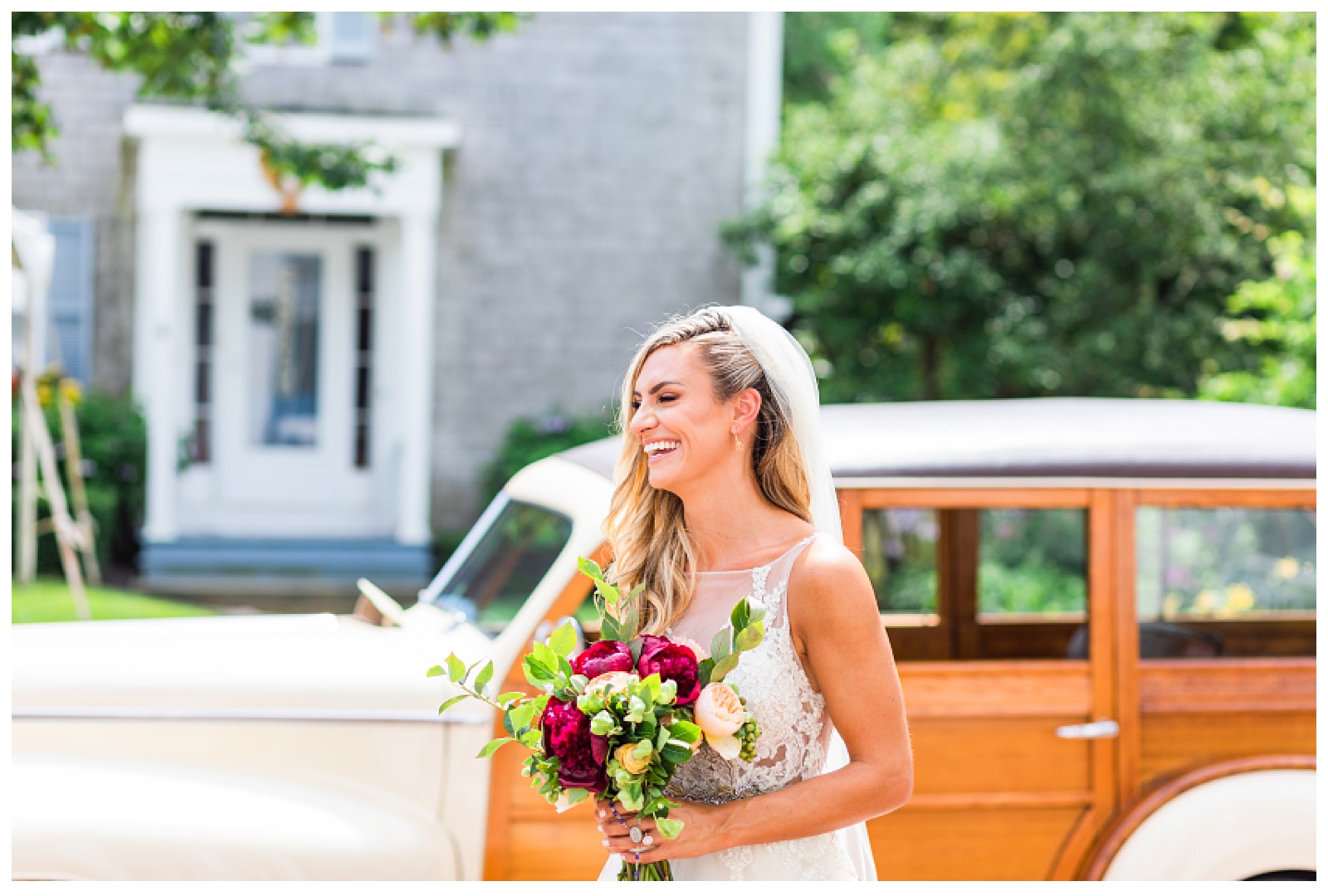 bride looking off into distance holding bouquet and laughing