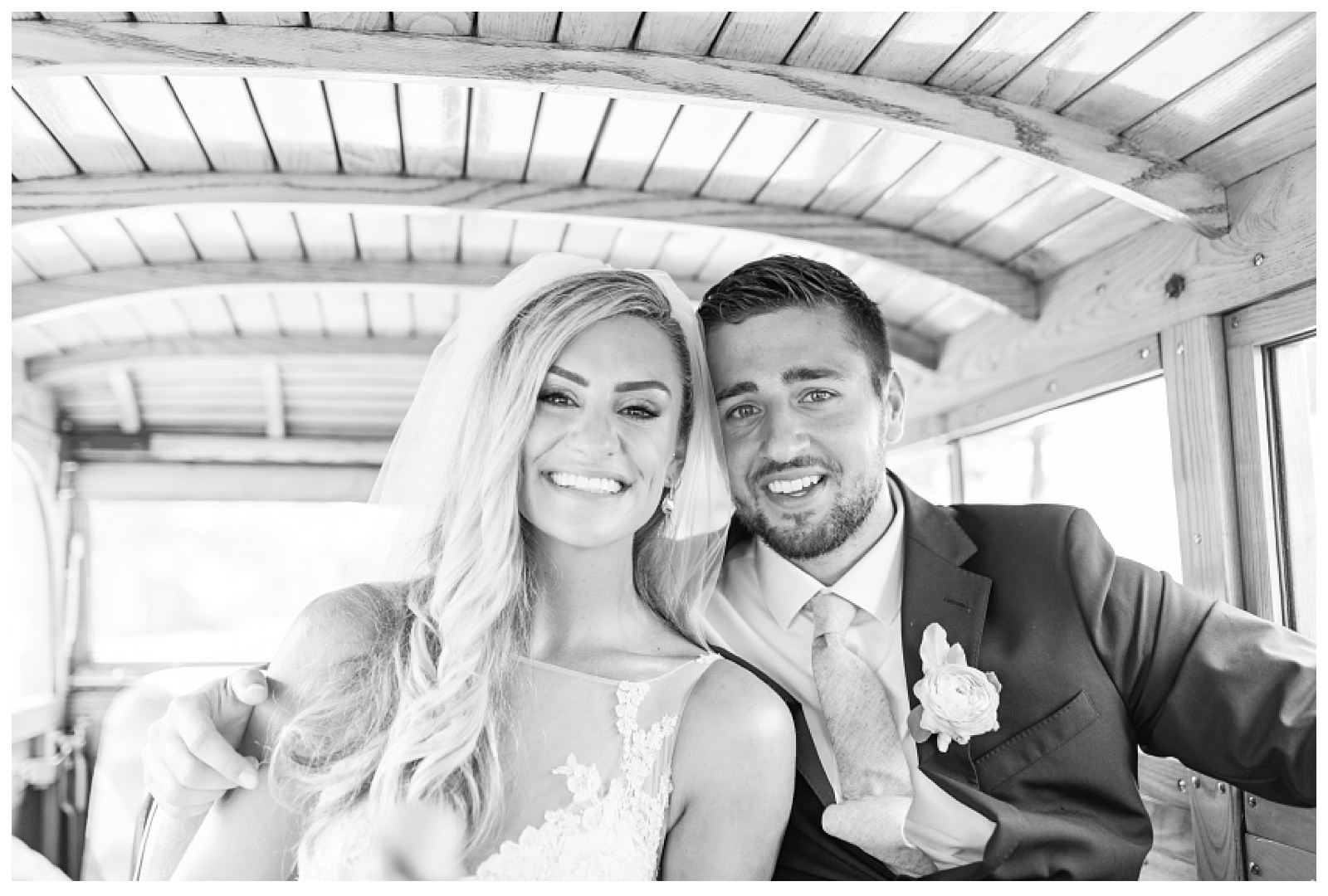 bride and groom in the backseat of old car