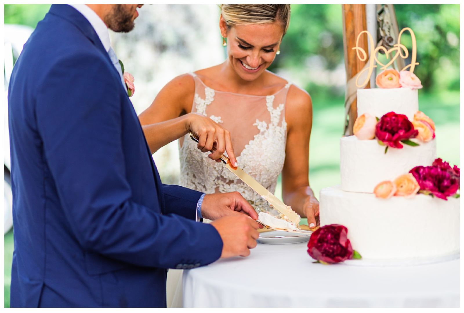 bride and groom cutting cake